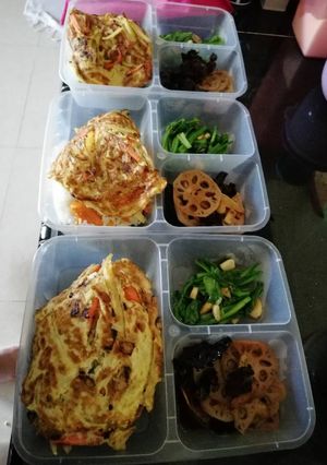 A picture of Pumpkin Rice with omelet, mix vegetables.