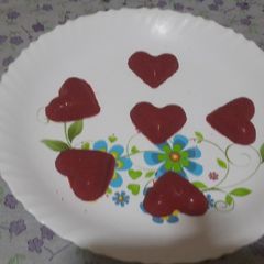 A picture of White chocolate compound red heart shape chocolate.