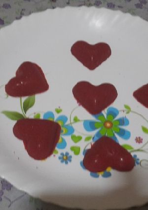 A picture of White chocolate compound red heart shape chocolate.