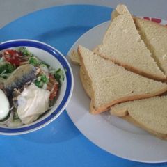 Bread with sardine,egg,vegetables and mayonise A picture of Bread with sardine,egg,vegetables and mayonise.