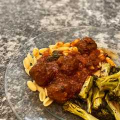 A picture of Slow Cooker Meatballs + pasta sauce.