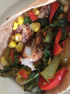 A picture of Healthy low fat baked fish tacos with “grilled” corn.