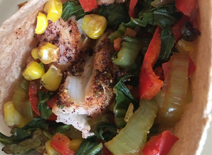 A picture of Healthy low fat baked fish tacos with “grilled” corn.