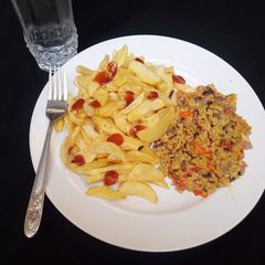A picture of Chips and egg sauce.