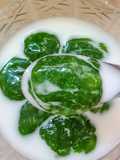 Khanom Inthanin (Pandan Tapioca Pearls with Coconut Syrup)
