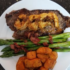 A picture of Cajun Shrimp Steak with Honey Glazed Bacon Asparagus.