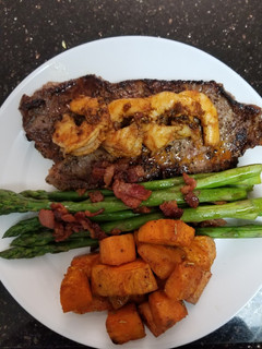 A picture of Cajun Shrimp Steak with Honey Glazed Bacon Asparagus.