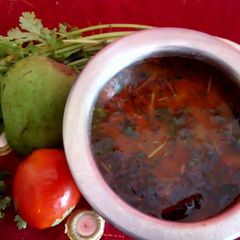A picture of Dal fry with raw mango.