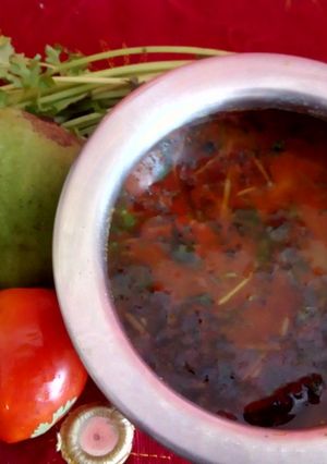 A picture of Dal fry with raw mango.