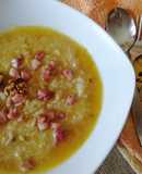 Risotto su vellutata di zucca con noci e pancetta croccante