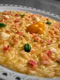 Risotto con acqua di datterino giallo, infuso di camomilla, pecorino romano e prosciutto cotto 🌼🧀🥓