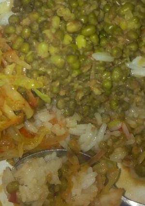 A picture of Rice with green grams and cabbages.