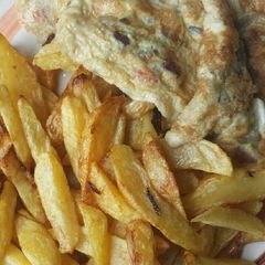 A picture of Chips and fried egg.
