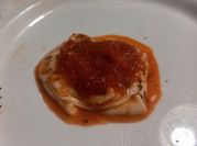 Una foto de provolone orégano