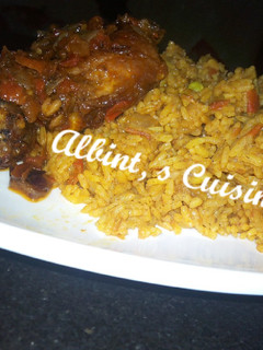 A picture of Jollof rice with peppered chicken.