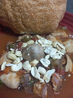 A picture of Sicilian Hake Stew with Raisins and Mushrooms.