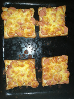 A picture of Sausage on bread pizza.