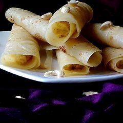 A picture of Kheer'r Patishapta pithe (a traditional Bengali sweet delicacy).