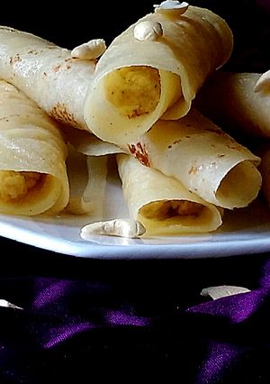 A picture of Kheer'r Patishapta pithe (a traditional Bengali sweet delicacy).