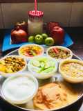 Ridge gourd Sabzi,Lauki-Channadal,MixedVeg,Curd,Dry Moong dal,Pooris,Fruits