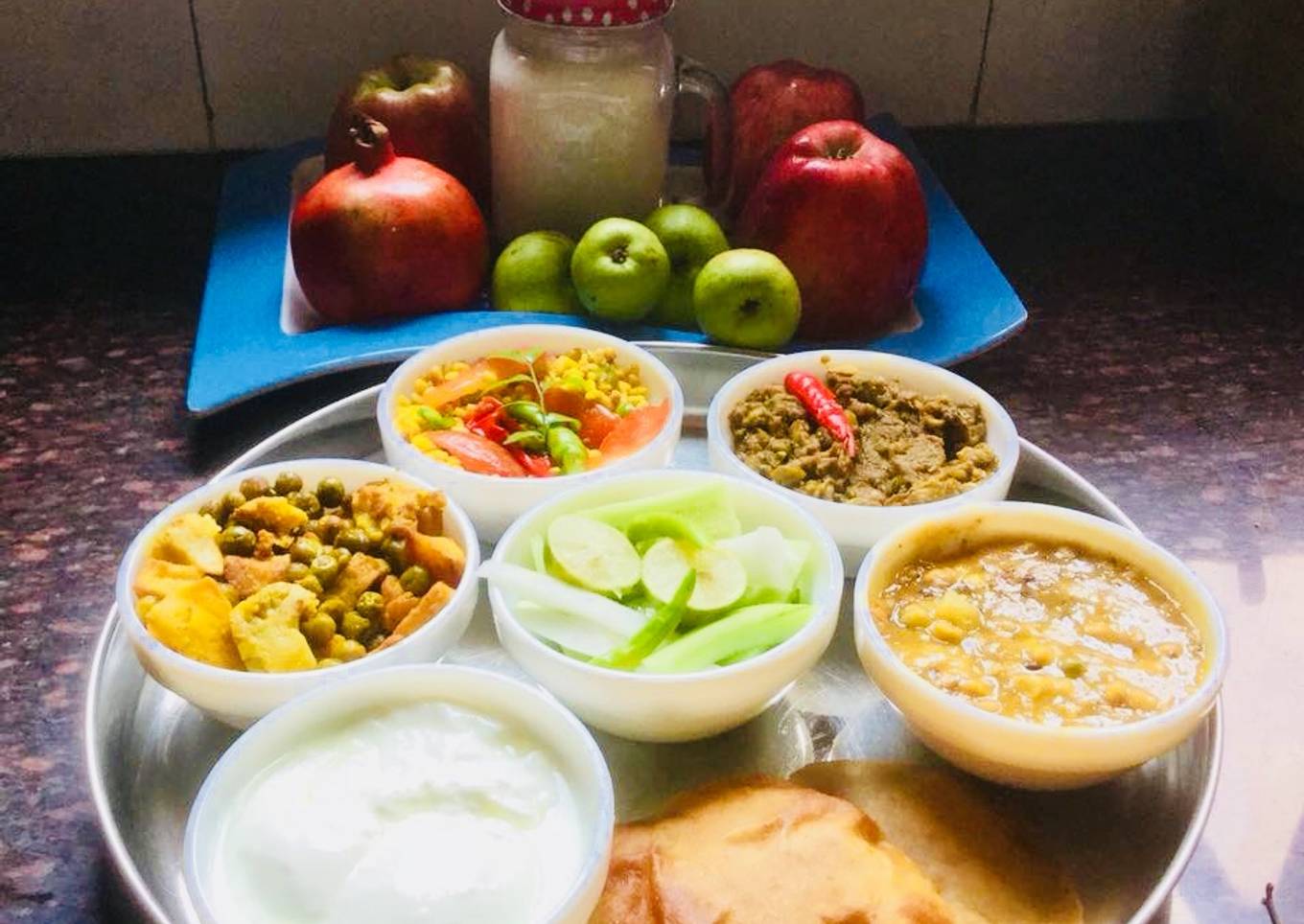Ridge gourd Sabzi,Lauki-Channadal,MixedVeg,Curd,Dry Moong dal,Pooris,Fruits