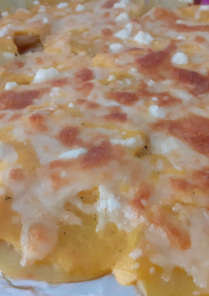 Una foto de Patatas al horno con gratinado de calabaza