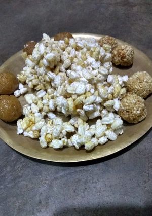 A picture of Khoi gur,naru and tiler Nadu(parched rice jaggery mix, coconut and sesame ladoo).