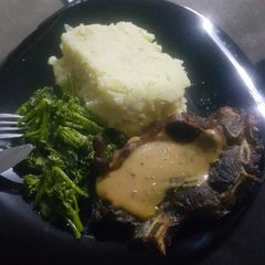 A picture of Creamy mash and steak.