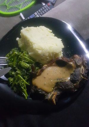 A picture of Creamy mash and steak.