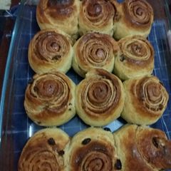 A picture of Cinnamon rolls with raisins.