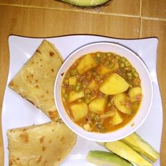 A picture of Potato and pea curry.