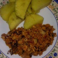 A picture of Boiled fresh Potatoes and egg sauce.