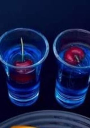 A picture of Butterfly pea tea shots.