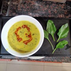 A picture of Spinach/Palak Kadhi with garlic sesame tadka.
