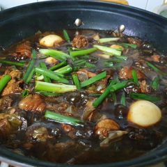 A picture of Basied chicken with eggs.