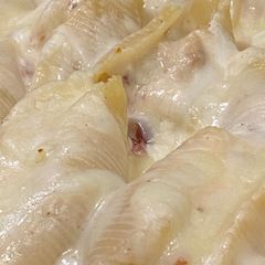 A picture of Chicken Bacon Ranch Stuffed Shells with Parmesan Garlic Sauce.