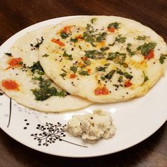 A picture of Tomato Onion Uttapam.
