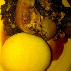 A picture of Vegetable soup and eba.