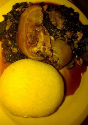 A picture of Vegetable soup and eba.