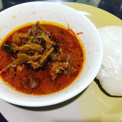 A picture of Banga soup with pounded yamg.