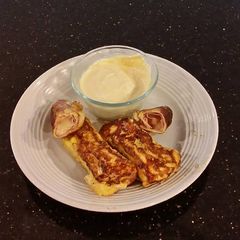 A picture of Ham and Cheese Toasted Roll Ups.