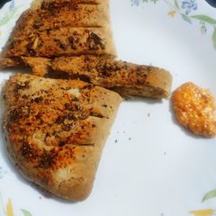 A picture of Cheesy Garlic Bread with cheesy dip.