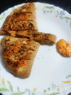 A picture of Cheesy Garlic Bread with cheesy dip.