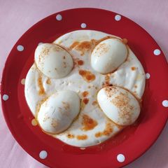 A picture of Boiled eggs with a delicious cheese sauce 🤤.