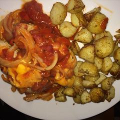 A picture of Cheesy pork rolls with roasted potato cubes.