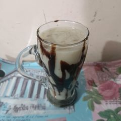 Banana shake with choclate syrup A picture of Banana shake with choclate syrup.