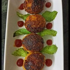 A picture of Leftover rice ka makeover....Rice corn vada in appam pan.