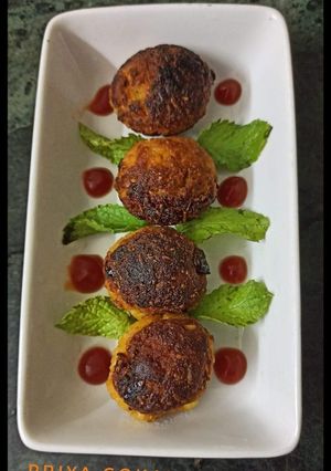 A picture of Leftover rice ka makeover....Rice corn vada in appam pan.