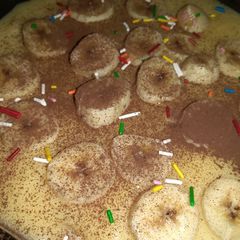 A picture of Simple custard with banana topping.