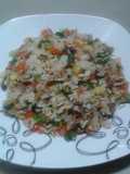 Arroz con vegetales y pernil